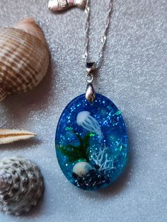 Resin jellyfish necklace with glow feature. Handmade. 20 inch water ripple silver plated chain and. 2" extender with charm. Gift boxed Resin Jellyfish, Jellyfish Necklace, Charm Gift, Jellyfish, Jewelry Necklace Pendant, Silver Plated, Etsy Accessories, Gift Box, Jewelry Necklaces