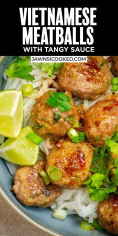 a plate with meatballs, rice and cilantro on it