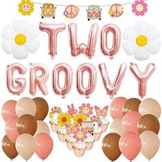 two groovy balloons and flowers are in front of a sign that says, two groovy