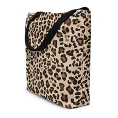 This is a large trendy tote bag with dimensions of 16 inches by 20 inches, and one interior pocket, featuring an adorable leopard animal print. It is perfect for carrying your groceries, books, or other items, going to the beach, while also showing off your love for a wild animal. The bag is made of durable material and has a spacious interior, making it ideal for everyday use. • 100% polyester • Maximum weight limit – 44lbs (20kg) • Large inside pocket • Comfortable cotton webbing handles • Vib Going To The Beach, Trendy Tote Bags, Leopard Animal, Trendy Tote, Wild Animal, Large Tote Bag, Large Tote, Laptop Sleeves, Animals Wild