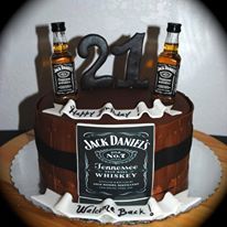 a birthday cake made to look like a barrel with two bottles on top and the number twenty