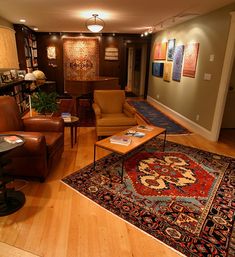 a living room filled with furniture and rugs