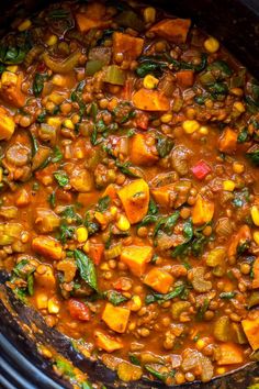 a pot filled with stew and vegetables on top of a stove