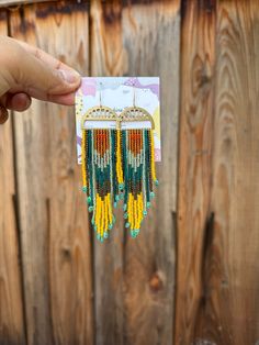 25% off if you buy 3 pieces , applicable to entire shop. Use  code 25off3  Adorn this handmade fringe earrings. The color combo is a attractive one with shades of white blue and orange . The length is around 2.5 inches from the ear lobe. The fringes have a great movement. The earrings have been made with attention to detail and takes around 5 hours to make a pair.  Let me know if you have any questions. Summer Chandelier Earrings With Dangling Beads, Summer Chandelier Dangle Earrings With Beads, Summer Chandelier Dangle Earrings With Dangling Beads, Summer Chandelier Dangling Bead Earrings, Summer Beaded Fringe Dangle Earrings, Summer Beaded Fringe Drop Earrings, Bohemian Yellow Chandelier Earrings With Dangling Beads, Bohemian Heishi Beads Dangle Earrings, Festival Beaded Fringe Long Drop Earrings