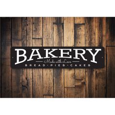 bakery sign on wooden wall with wood paneling