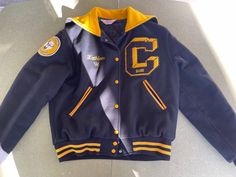 Vintage 1996 Varsity Wool Jacket Black and Yellow Centerville High-school.  Size L. 100% Wool.  Made by Gem Sportswear  Sport are Band and Color Gurd This was "Kathleen "' s Jacket Laying flat measurements are  24 inches long  22 inches armpit to armpit  19 inches armpit to wrist 28 inches shoulder to wrist Winter Sports Outerwear With School Spirit Style, Collegiate Winter Outerwear For School, Sporty Navy Outerwear For School, Winter School Spirit Outerwear For College, School Spirit Winter Outerwear For Streetwear, School Spirit Outerwear For Fall Streetwear, School Spirit Outerwear For Streetwear In Fall, Black And Yellow, Wool Jacket