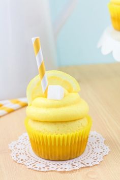 a cupcake sitting on top of a white doily