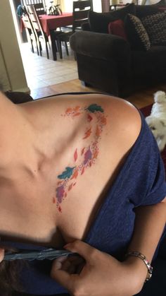 a woman with a tattoo on her chest