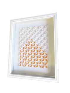 a white frame with an orange piece in it