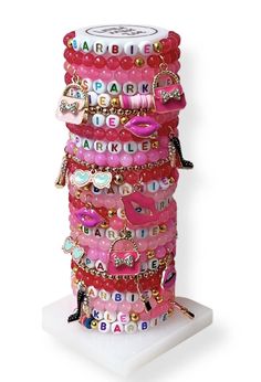 Get ready to make a fashion statement with Little Miss Zoe limited-edition Barbie Lover Tower. Assorted bracelets: Gemstone bracelets, word bracelets, dainty gold bracelets, vinyl bracelets 25 Stretch bracelets on display - Assorted words/charms display tower included (not included with reorders) Bracelet size: 6" handmade in USA kids/ children/ tween/ girls Due to the nature of handmade product, Color and charms may vary Little Miss Bracelets, Pink Letter Beads Bracelet For Party, Trendy Name Bracelet For Valentine's Day, Trendy Letter Beads Name Bracelet For Valentine's Day, Trendy Name Bracelet With Letter Beads For Valentine's Day, Trendy Bracelets For Valentine's Day Party, Custom Name Pink Charm Bracelet, Trendy Valentine's Day Name Bracelet With Letter Beads, Personalized Adjustable Charm Bracelet For Party