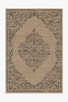 a beige rug with an intricate design on the bottom and sides, in black ink