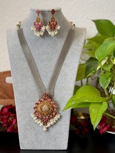 An elegant grand dual tone kundan jadau necklace set for your local gatherings or parties. The length of the kundan haram is given in one of the pictures. Measurements of the earrings  Height: 6 Cm  Width : 3.5 Cm  Care Instruction : Avoid Heat & Chemicals Like Perfume, Deo, Alchol, Etc. | Clean With Dry Cotton Cloth | Pack In our Anti tarnish box after use. Dual-tone Kundan Temple Jewelry Sets, Festive Dual-tone Kundan Jewelry Sets, Dual-tone Kundan Chandbali Bridal Necklace, Dual-tone Chandbali Kundan Bridal Necklace, Gold Dual-tone Kundan Necklace For Celebration, Gold Dual-tone Chandbali Kundan Necklace, Dual-tone Kundan Chandbali Temple Necklace, Dual-tone Chandbali Kundan Temple Necklace, Festive Dual-tone Kundan Bridal Necklace