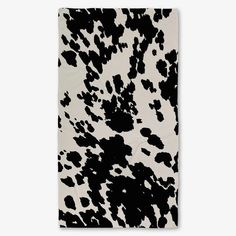 a black and white cow print towel