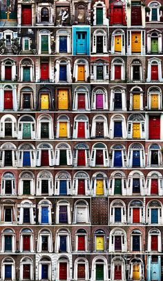 many different colored doors are stacked on top of each other