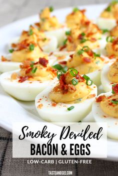 deviled eggs with bacon and green onions on a white plate