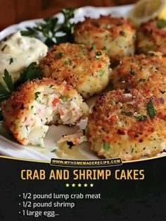 crab and shrimp cakes on a plate with lemon wedges