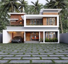 a car is parked in front of a two story house with palm trees on either side