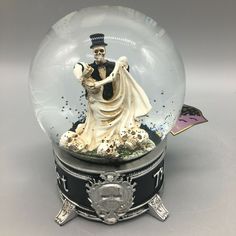 a snow globe with a figurine in it