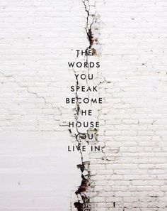 the words you speak become the house you live in written on a white brick wall