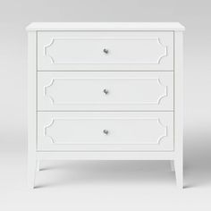 a white chest of drawers with three drawers on one side and two drawers on the other