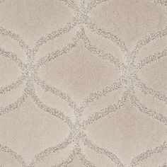 a close up view of a beige carpet with diamond shapes on it's surface