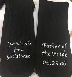 two black socks with white writing on them that say special socks for a special walk