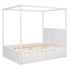 a white bed frame with drawers underneath it