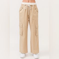 Beige Cotton Wide Leg White Waistband Cargo Pants Waist 16” Un-Stretched Inseam 29” Questions? Leave A Comment Below! Beige Utility Bottoms With Elastic Waistband, Utility Style Mid-rise Beige Bottoms, Mid-rise Beige Cargo Bottoms, Beige Utility Pants With Elastic Waistband, Beige High-waist Parachute Pants With Elastic Waistband, Beige High Waist Parachute Pants With Elastic Waistband, High-waisted Beige Parachute Pants With Elastic Waistband, Beige Straight Leg Cargo Pants With Elastic Waistband, Casual Beige Mid-rise Bottoms