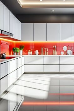 a modern kitchen with white cabinets and red backsplash lighting up the space above