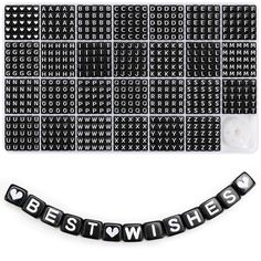 black and white stickers with the words best wishes written on them next to a keyboard