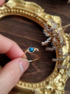 Dainty Apatite Eye Ring 💙 This is a handmade wire-wrapped ring with a natural gemstone and a choice of 14K Gold filled, Rose Gold Filled, and Sterling Silver. Waterproof and tarnish-free. Dainty and cute design, perfect for every day wear & gift!Sizing:• Gemstone sizer: 4 mm• Ring Band: 0.8 mm✨ Apatite is a stone of inspiration & motivation. It is great for artists & creative people as it lights the path to self-expression & motivation. It can also help with focus and is great for studying & wo Natural Stone Rings Gemstone, Natural Stone Rings, Handmade Wire Wrapped, Wire Wrapped Rings, Eye Ring, Handmade Wire, Creative People, Ring Band, Polish Jewelry