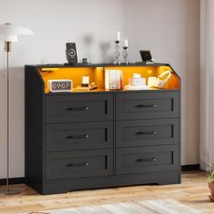 a black and yellow dresser in a living room