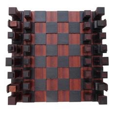 a wooden chess board with black and brown squares