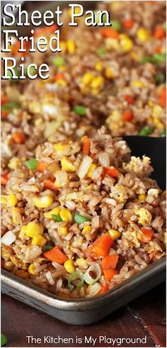 a pan filled with fried rice and vegetables