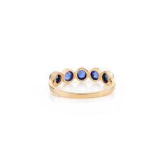 This is part of Chairish’s Fine Jewelry assortment.  Blue Sapphire Bezel Set Band Stacking Ring in 14K Gold symbolizes the everlasting love between a couple. It shows the infinite love you have for your partner. The round shape represents love which will continue and makes your promises stay forever. Sapphire stimulate concentration and reduces stress. Lightweight and gorgeous, this is a perfect blue sapphire band. It can be a Bridal Shower Gift, Valentine's Gift, Gift For Sister, Mother Daughte Classic Sapphire Ring With Smooth Bezel For Anniversary, Elegant Birthstone Ring With Smooth Bezel For Wedding, Fine Jewelry Sapphire Ring With Smooth Bezel For Anniversary, Classic Anniversary Birthstone Ring With Smooth Bezel, Elegant Wedding Birthstone Ring With Smooth Bezel, Elegant Birthstone Ring With Smooth Bezel, Yellow Gold Sapphire Stackable Rings With Bezel Setting, Elegant Sapphire Ring With Smooth Bezel As Gift, Round Sapphire Ring With Smooth Bezel For Promise