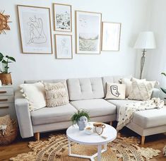 a living room filled with lots of furniture and pictures on the wall above it's coffee table