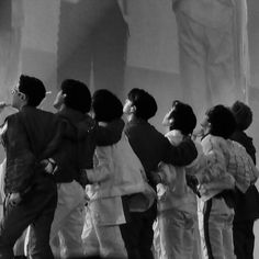 black and white photograph of children standing in front of the lincoln memorial