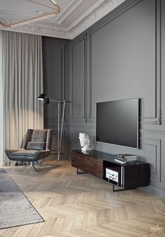 an empty living room with grey walls and wood flooring