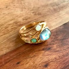 Aura Quartz Ring Surrounded By Synthetic Opal & Emerald Stones With Gold Toned Setting & Band Size: 9 Gold Bohemian Multi-stone Rings, Bohemian Gold Multi-stone Rings, Gemstone Rings Unique, Colored Stone Rings, Opal Ring Gold, Synthetic Opal, Ring Ideas, Emerald Stone, Aura Quartz