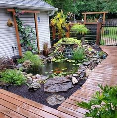 a small pond in the middle of a wooden deck