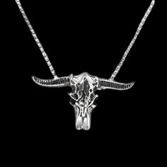 Introducing our stylish Bull Skull Head Necklace, made from high-quality stainless steel, this necklace is the perfect accessory for anyone who loves to make a statement with their jewelry. With its unique and bold design, this necklace is sure to turn heads and start conversations. Crafted with meticulous attention to detail, the Bull Skull Head pendant is intricately designed, making it a true work of art. Its sturdy construction ensures it will last for years to come, making it a great investment piece that will become a treasured part of any jewelry collection. This necklace is the perfect accessory for those who appreciate edgy and unique styles. Whether you're dressing up for a night out or simply adding a touch of attitude to your everyday outfit, this necklace will take your style Skull Shaped Stainless Steel Necklace Gift, Gothic Skull Necklace In Stainless Steel, Unique Engraved Stainless Steel Necklaces, Silver Skull Necklace With Adjustable Chain, Nickel-free Stainless Steel Skull Necklace, Skull-shaped Engraved Stainless Steel Necklace, Skull Shaped Engraved Stainless Steel Necklace, Skull Shaped Stainless Steel Jewelry For Gifts, Engraved Skull Necklace In Stainless Steel