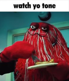 a red monster holding a plate with food on it and caption that reads, watch yo tone