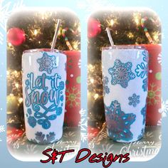 two cups with straws in front of a christmas tree and snowflakes on it