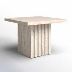 a square table made out of marble with four columns on each side and one column at the top