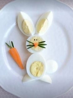 an easter bunny made out of eggs and carrots