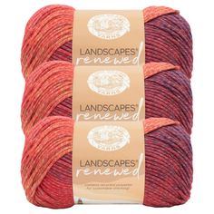 three skeins of red and orange yarn with the words landscapes removed on them