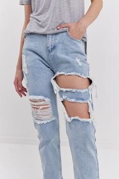 A cropped and ripped denim with high rise and pockets. We love a good denim Jean. Especially one with some personality and attitude. With a cut out design and a straight leg, this jean is perfect for all your summer events. Dress them up or down, wear them day or night- these jeans are the perfect addition to your wardrobe. Ripped Distressed Straight High rise Machine wash cold Do not bleach Tumble dry low Iron low if needed Shell: 100% Cotton Lining: 65% Cotton 35% Polyester HN205P Total length: 39.7" Waist: 26.8" Inseam: 27.8" 1st picture wearing size 26, 2nd picture wearing size 28 BLACK: Height 5'10" / Bust 32"/ Waist 25"/ Hip 35.5" DENIM: Height 5'9" / Bust 32"/ Waist 24"/ Hip 34" Ultra High Waisted Jeans, Ripped Straight Leg Jeans, Pacsun Mom Jeans, Distressed Mom Jeans, Ripped Boyfriend Jeans, Pacsun Jeans, High Rise Mom Jeans, Cut Out Design, Straight Leg Denim