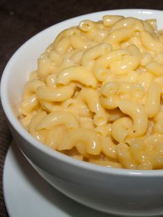 a white bowl filled with macaroni and cheese