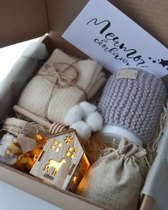 a box filled with christmas gifts sitting on top of a table