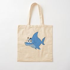 a tote bag with a cartoon shark on it